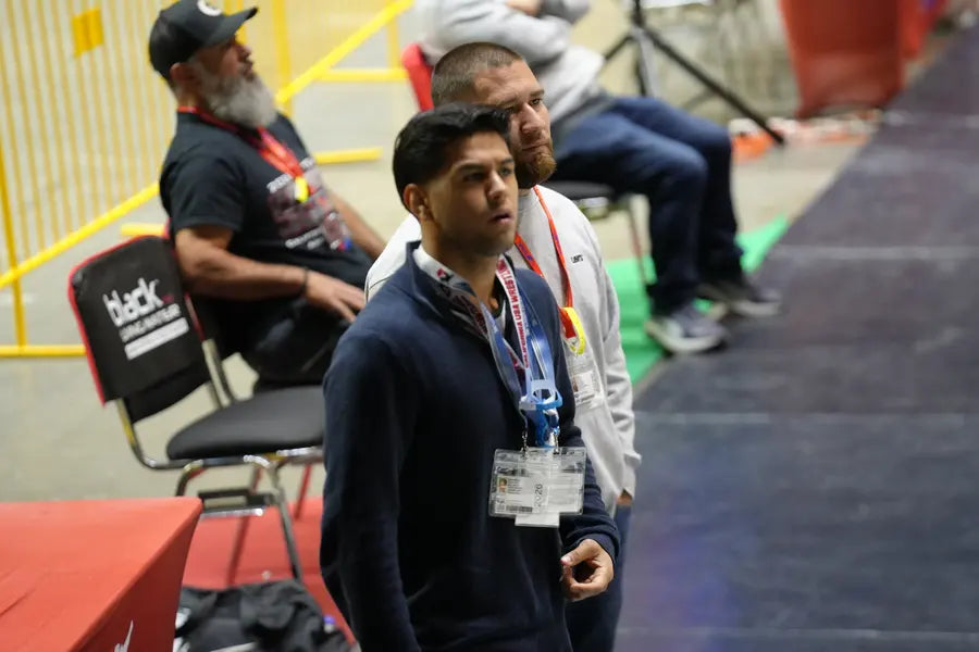 Deep Waters coaches watching intently from the corner at a tournament